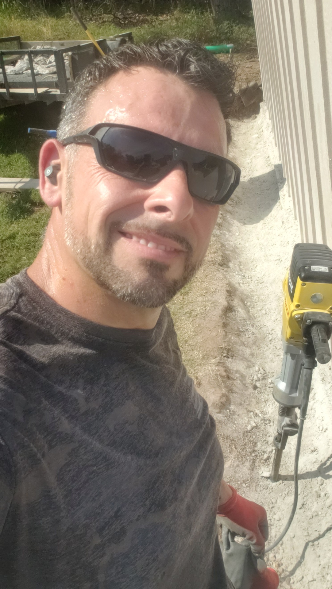 Efficient Precision Services owner on a job site with professional equipment, ready to serve Grand Lake property owners